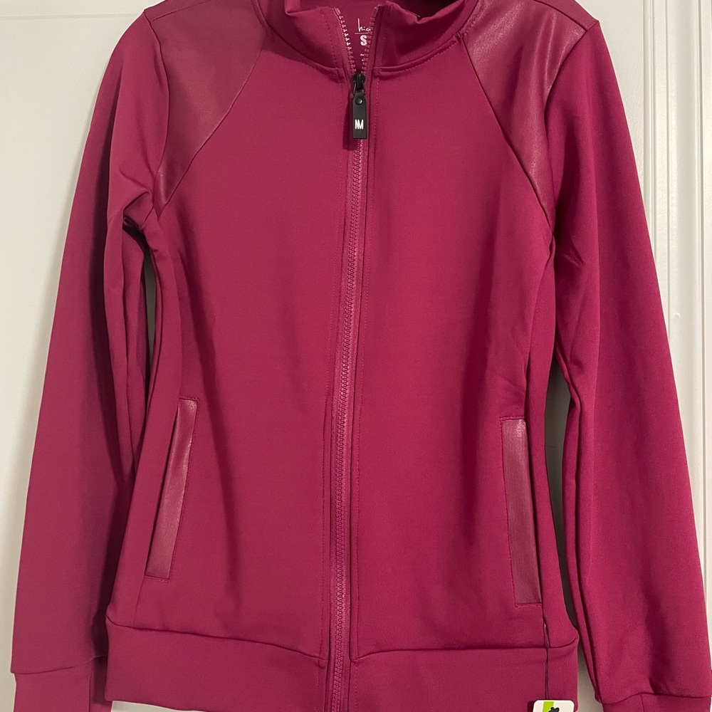 Nicole Miller sports zip up.